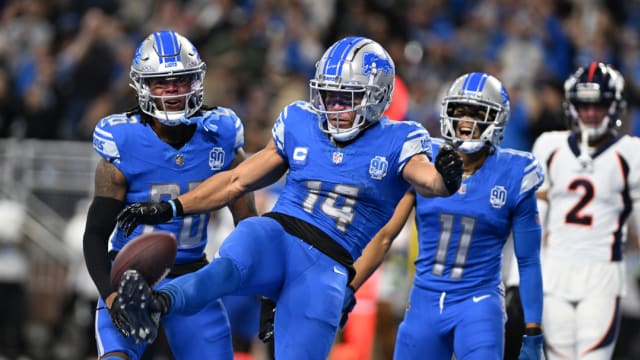Detroit Lions wide receiver Amon-Ra St. Brown celebrates a touchdown.